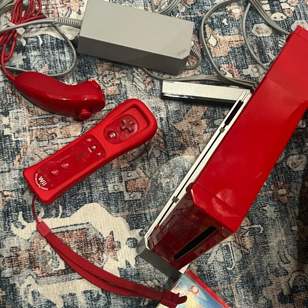 Nintendo Wii in Vibrant Red with Accessories controller. Some times. Works.